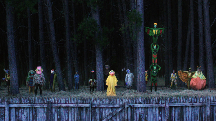 A variety of costumed freaks lie just beyond Greta's backyard.